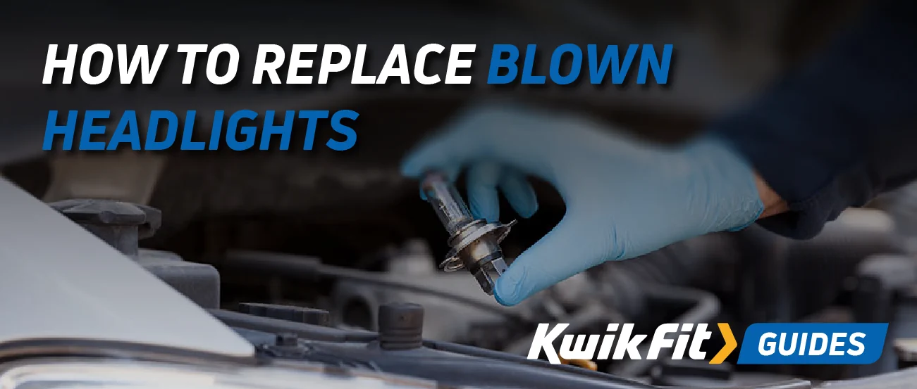Technician holding a car headlight bulb